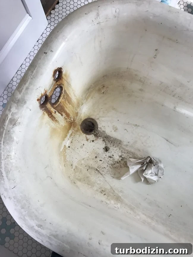 Rust stains around faucet holes in clawfoot tub