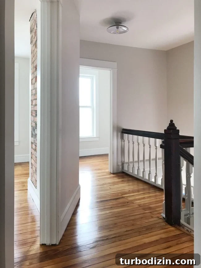 Heart Pine Floor Refinishing: Before and After Transformations 10 upstairs landing in beach house with refinished pine floors