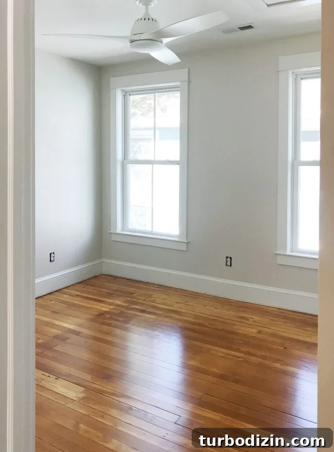 Heart Pine Floor Refinishing: Before and After Transformations 12 refinished pine floors upstairs bedroom white fan