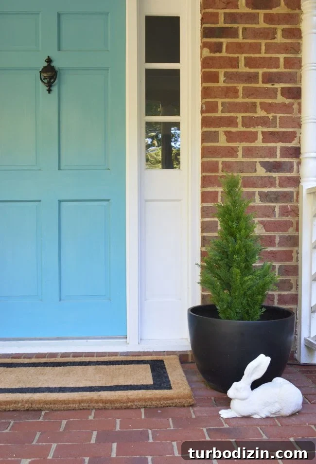 3 Quick Front Porch Updates to Boost Curb Appeal 2 Front Porch Fake Plant In Black Planter
