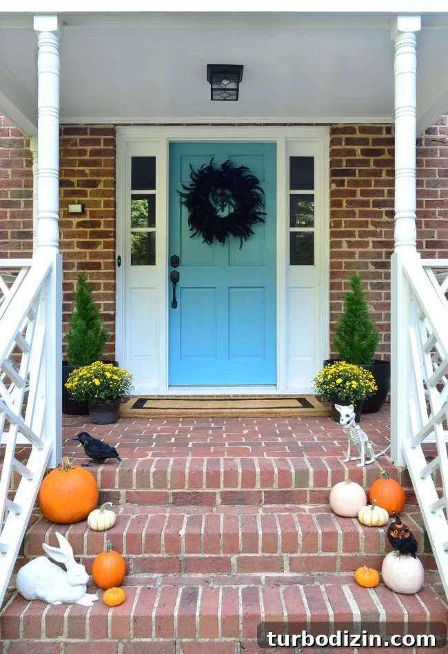3 Quick Front Porch Updates to Boost Curb Appeal 12 Front Porch Halloween Decor Pumpkins Blue Door Mums