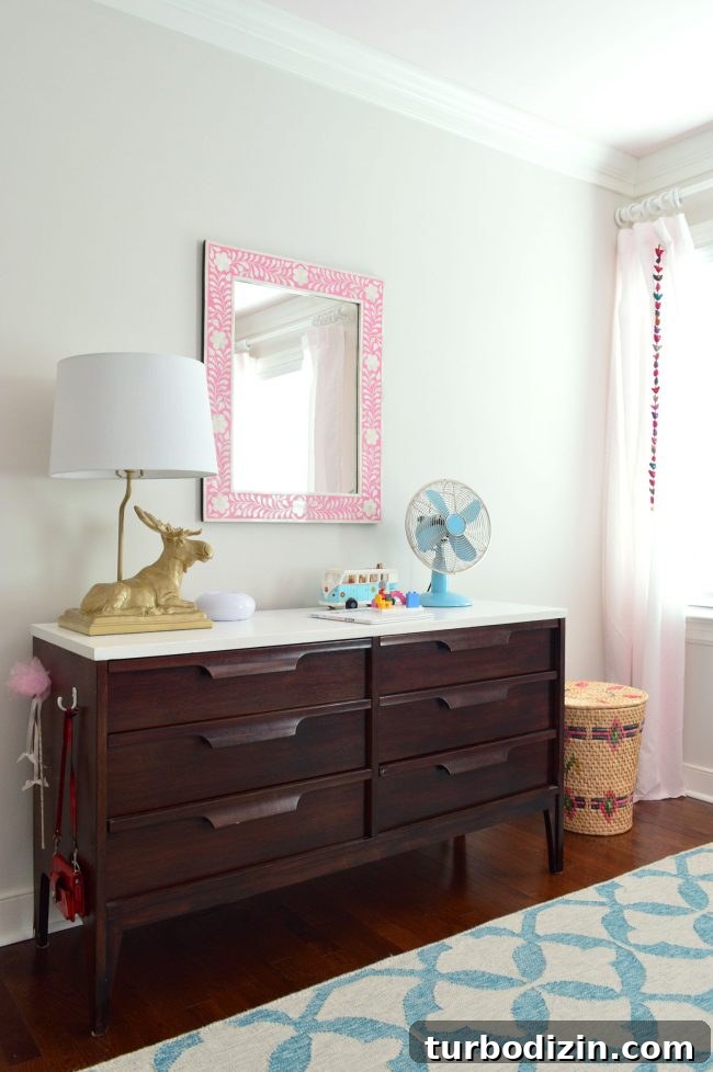 girls bedroom midcentury dresser pink mirror