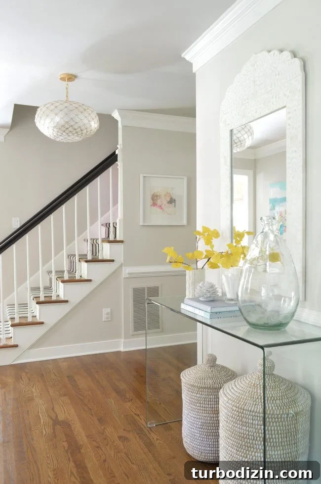 Foyer Refresh: New Lighting and Furniture Ideas to Transform Your Entryway 2 neutral foyer beachy capiz light gingko leaf