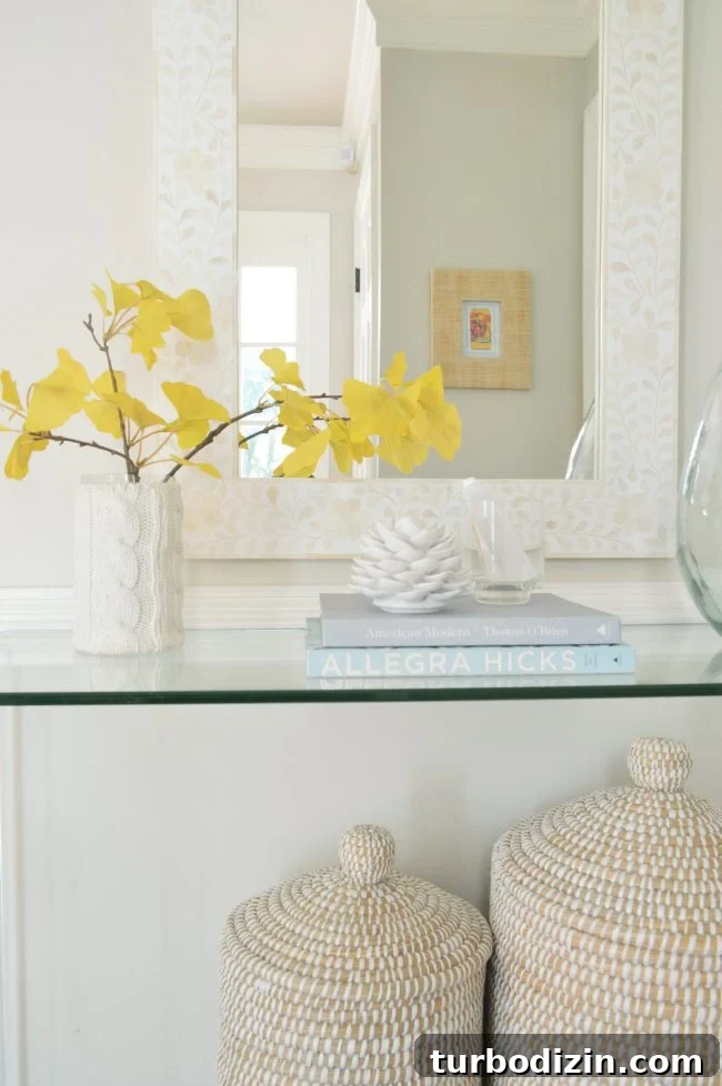 Foyer Refresh: New Lighting and Furniture Ideas to Transform Your Entryway 7 neutral foyer fake gingko branch decor