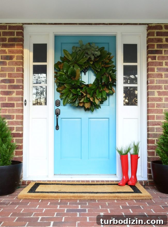 Holiday Home Tour: See Our Christmas Decorating Ideas 13 Front porch with wreath and boots