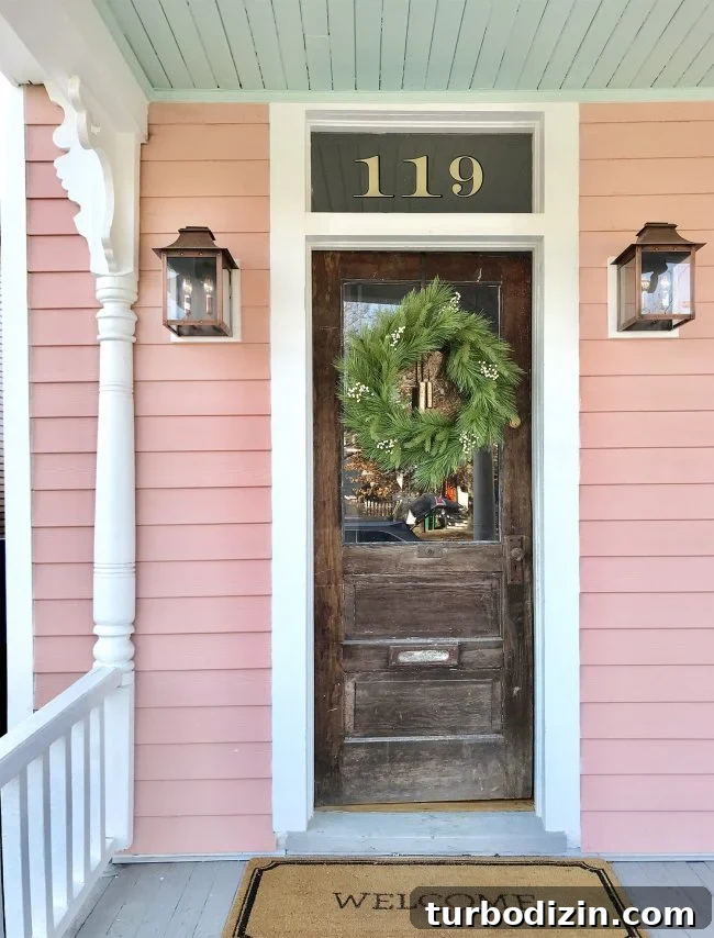 Front of house with wreath and lanterns