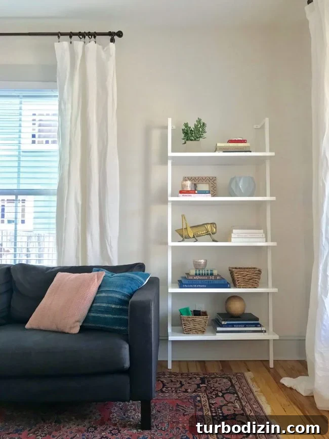 Living room with bookcase and curtains