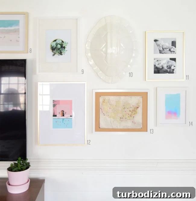 grid of white and gold frames on white gallery wall