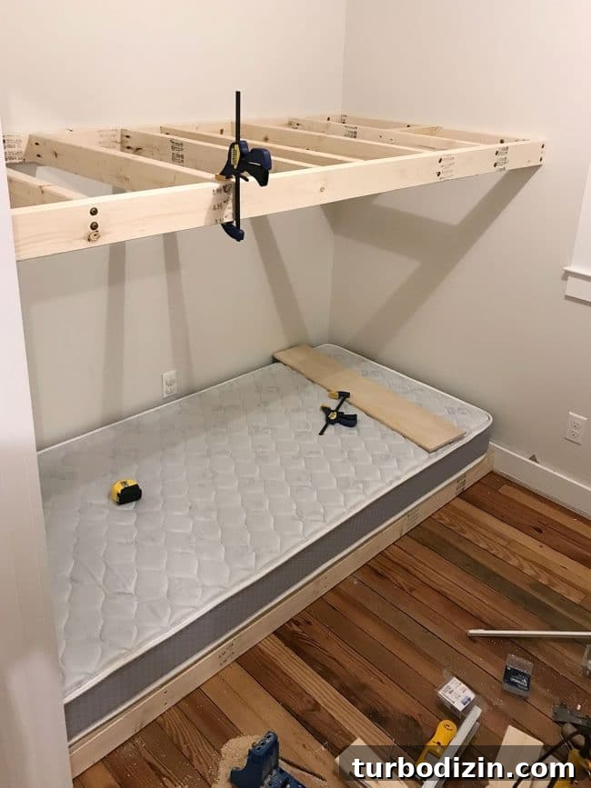 DIY Guide: Building Custom Built-In Bunk Beds for Your Home 13 top floating bunk added in wall to wall bunk beds