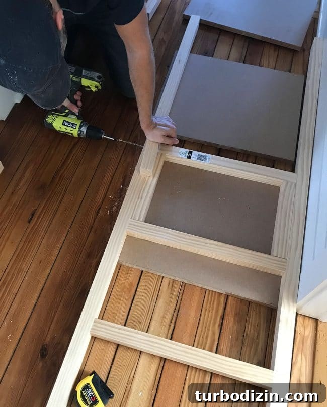 DIY Guide: Building Custom Built-In Bunk Beds for Your Home 18 screwing 2x2 wood pieces together to create bunk bed ladder