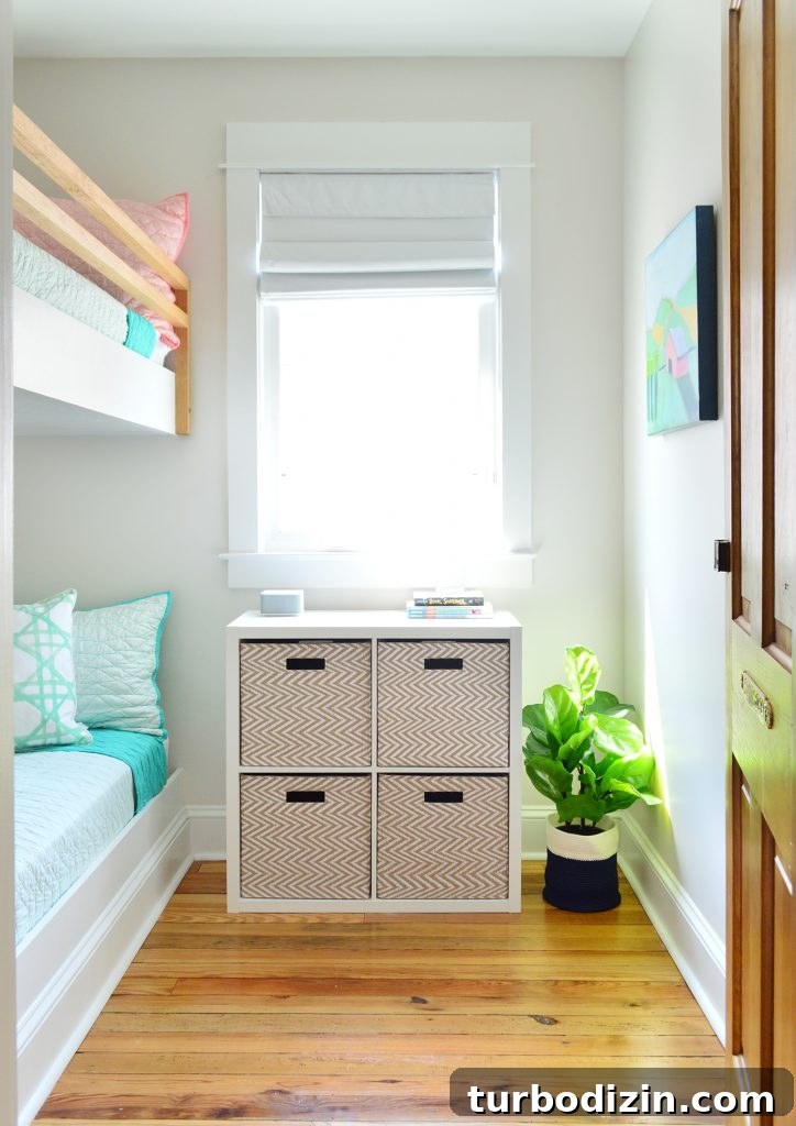 DIY Guide: Building Custom Built-In Bunk Beds for Your Home 25 view into small room bunk beds with cubby organizer baskets under window