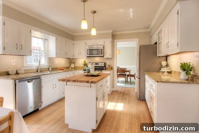 When Does a Home Renovation Harm Your Resale Value? 6 Staged kitchen with island centered