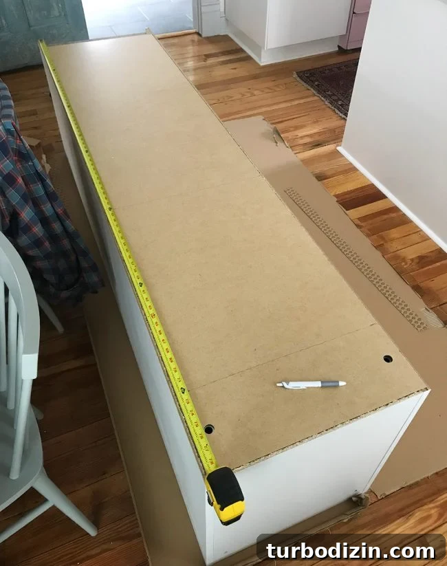 Conceal a Water Heater Using an IKEA Cabinet: Step-by-Step Guide 7 back of ikea pax wardrobe with marks for cutting hole