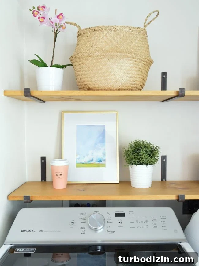 Conceal a Water Heater Using an IKEA Cabinet: Step-by-Step Guide 10 detail of open shelves above top loading washing machine with art basket orchid