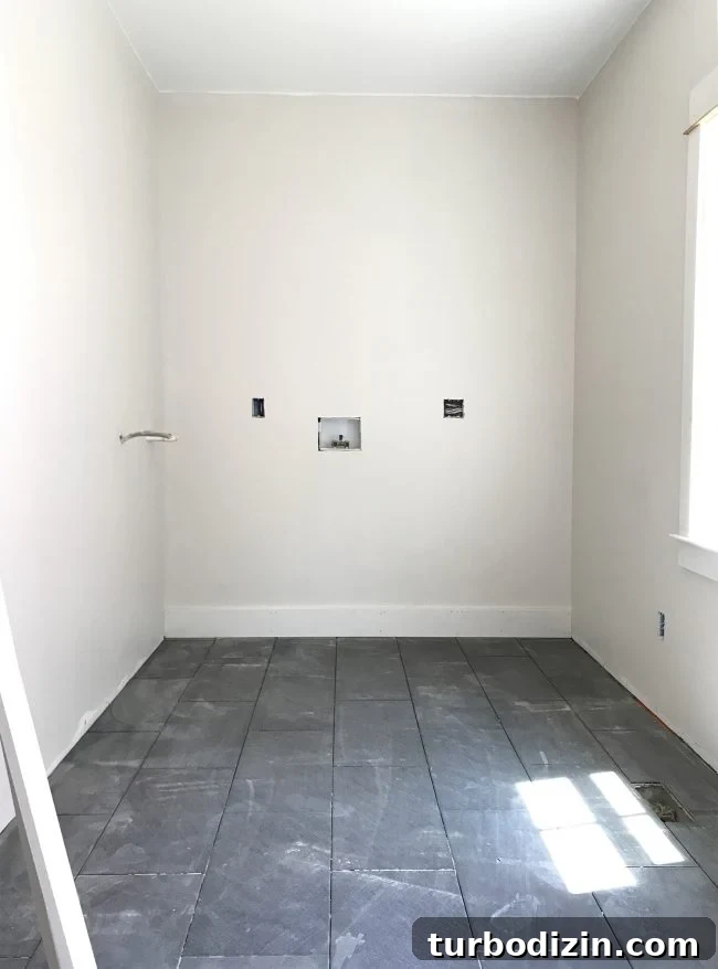 Conceal a Water Heater Using an IKEA Cabinet: Step-by-Step Guide 4 laundry room area after drywall paint and dark slate tile