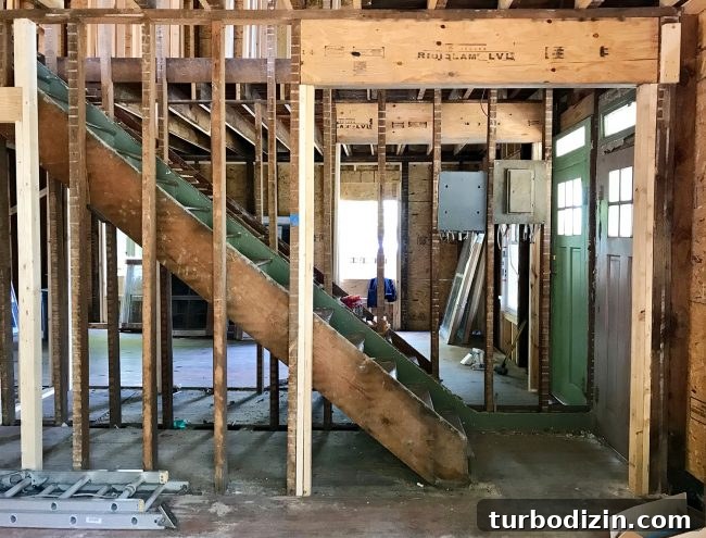 Duplex Renovation Complete: Fast Restoration of a Historic Home 17 Wider stair opening