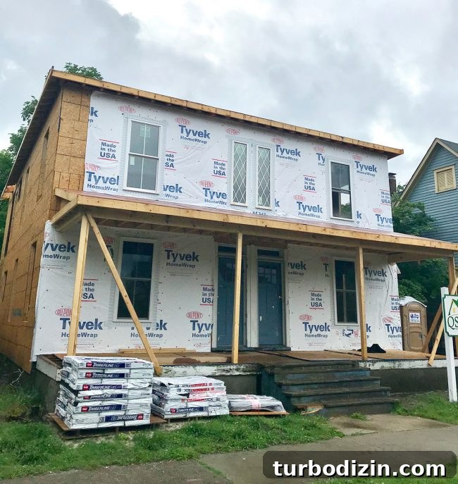 Duplex Renovation Complete: Fast Restoration of a Historic Home 3 Front windows installed