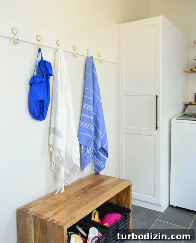 DIY Long Hook Rail for Mudroom: Step-by-Step Build & Install 7 after photo of towels and bathing suit on hook rail in mudroom