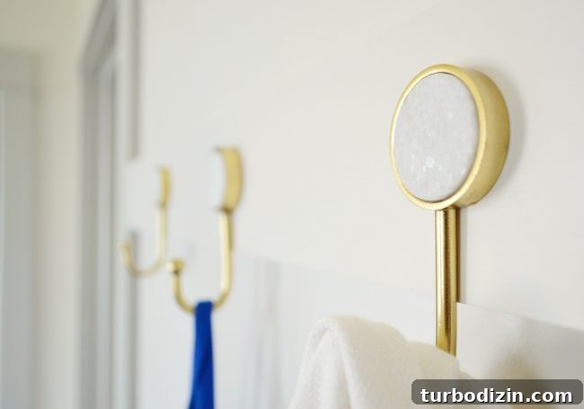 DIY Long Hook Rail for Mudroom: Step-by-Step Build & Install 8 detail photo of marble circle insert on gold hook from target