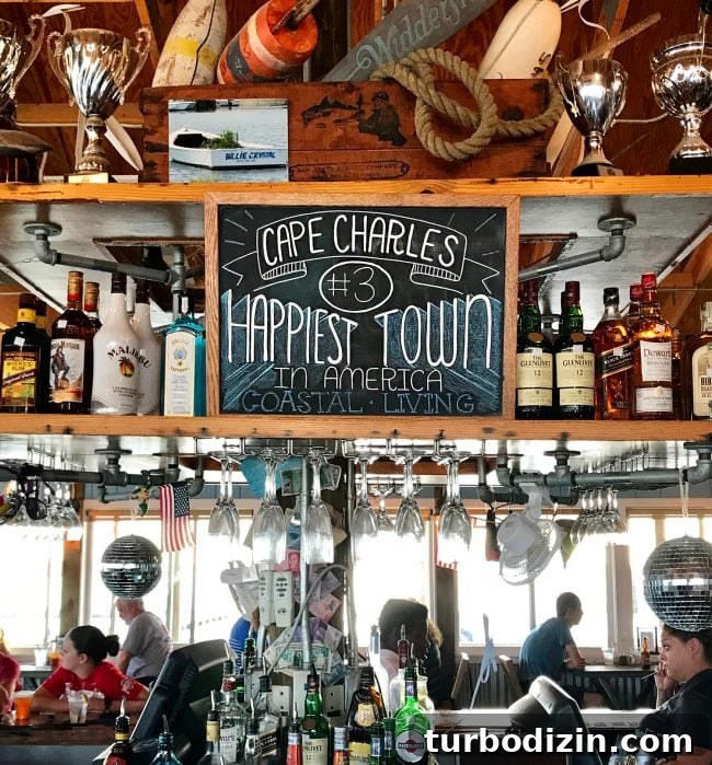 Cape Charles, Virginia: Your Complete Guide to the Beach Town 4 sign showing cape charles is happiest town in america by coastal living
