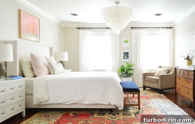 two windows in master bedroom with white curtains