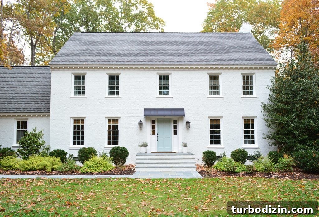 White Painted Brick Home With Bluestone Path
