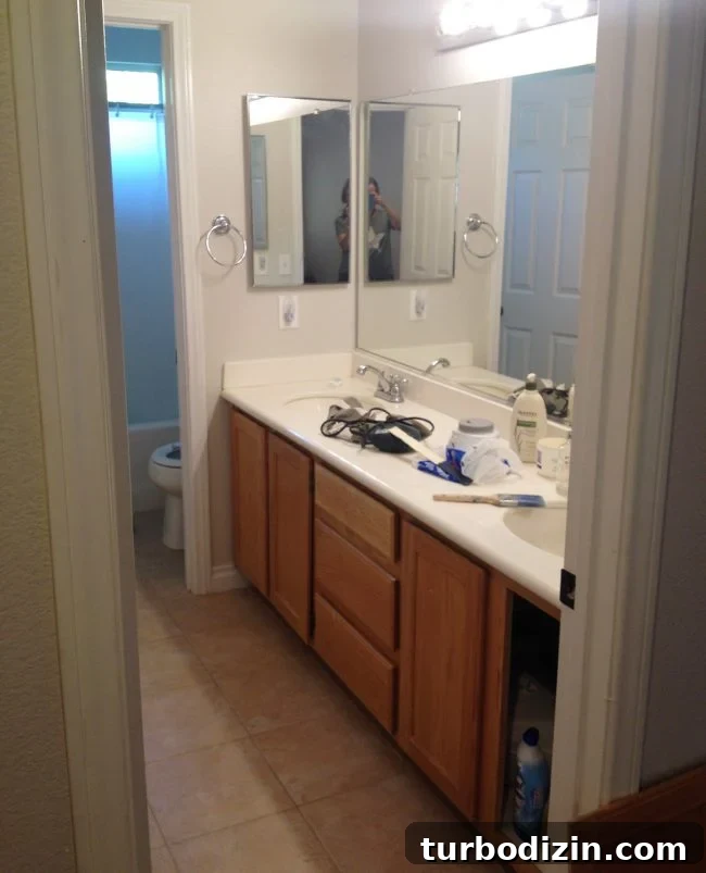 Before photo of beige bathroom tile