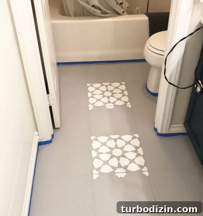 Stenciling being applied to tiled floor