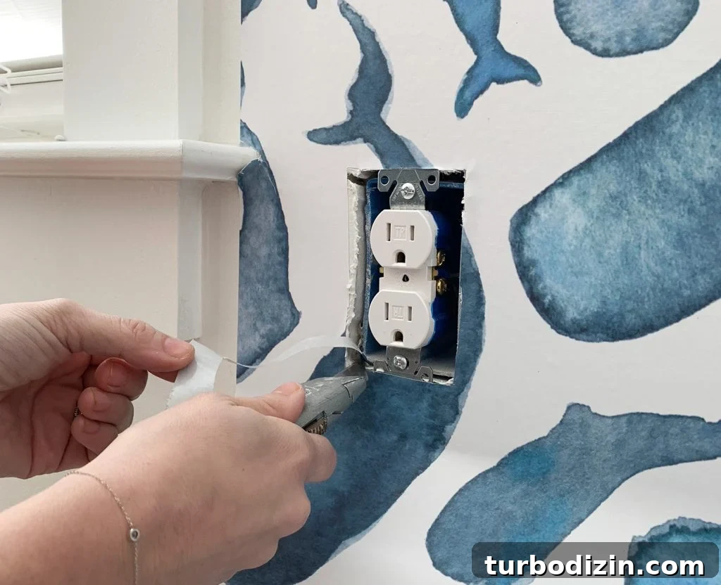Installing Removable Wallpaper By Cutting Around Electrical Outlet