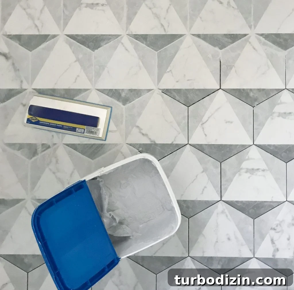 marble hex tiles getting grouted with mapei grout
