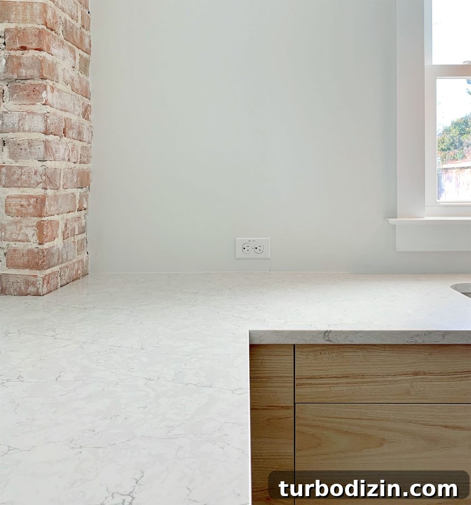 When Life Falls Apart: How to Find Stability When Everything Goes Wrong 3 Silestone Pearl Jasmine Quartz counters with wood cabinets and brick chimney