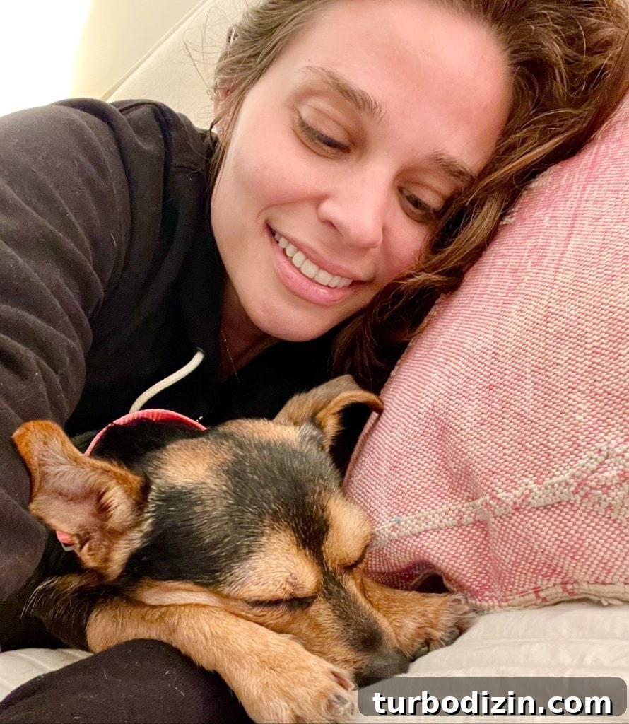 My Daily Skin and Hair Care Routine for Clear, Shiny Results 6 Penny the dog sleeping next to Sherry on pillow