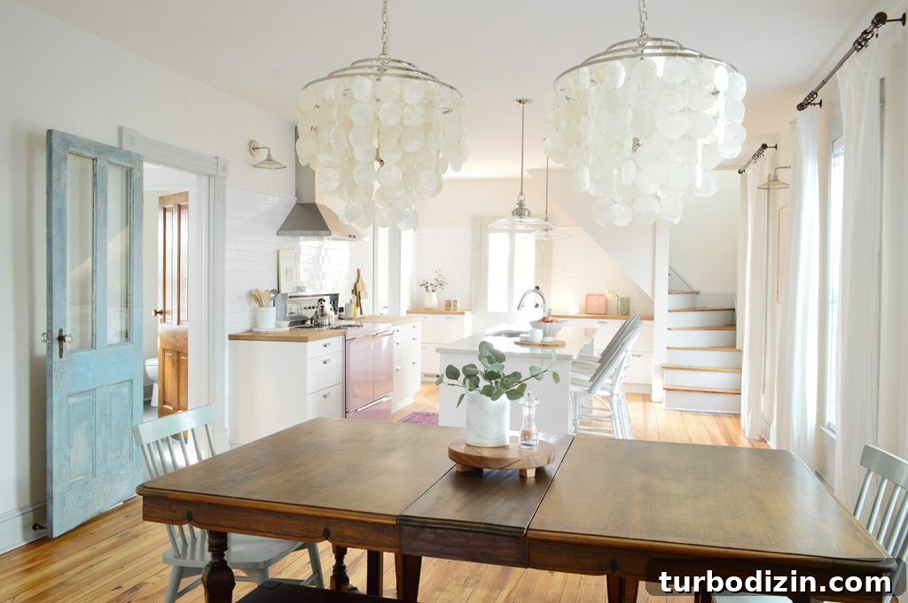 Bright, Airy Living Room Ideas That Stay Comfortable and Practical 17 view into beach house kitchen through dining room capiz chandeliers