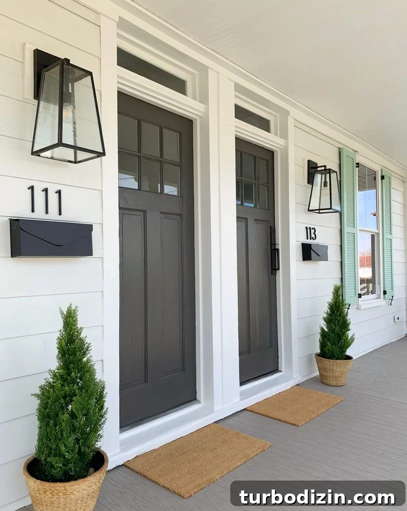 Duplex Front Porch Makeover: Stylish Curb Appeal Ideas 2 Duplex Front Porch From Angle With Oversized Black Lanterns And Matching Mailboxes