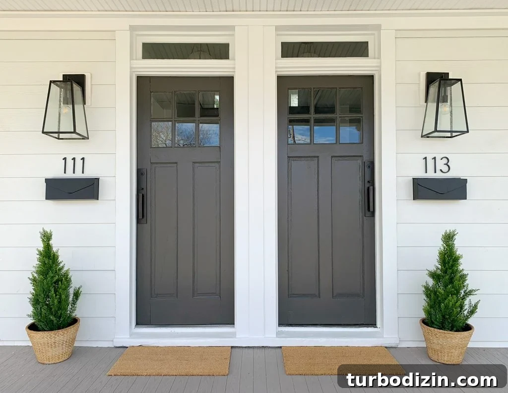 Duplex Front Porch Makeover: Stylish Curb Appeal Ideas 5 Duplex Front Porch With Matching Dark Gray Doors Plants House Numbers Mailboxes