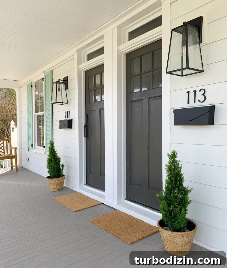 Duplex Front Porch Makeover: Stylish Curb Appeal Ideas 6 Duplex Front Porch From Angle With Doormats Planters And Benches In Similar Color