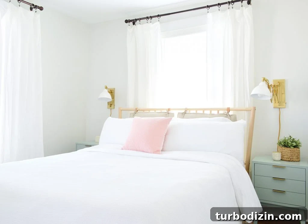 Duplex guest bedroom with bed in front of window