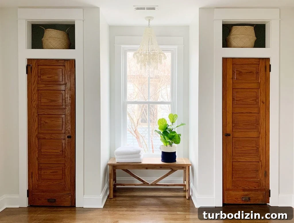 Low-Maintenance Houseplants and Lifelike Faux Alternatives 4 Faux fiddle leaf fig on bench between two closets under chandelier