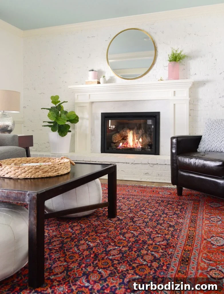 Low-Maintenance Houseplants and Lifelike Faux Alternatives 5 Faux greenery in living room with white walls and red vintage rug