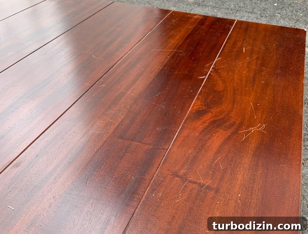 Refinish a Wooden Table: Step-by-Step Guide for Smooth Results 17 Before Photo of Red Damaged Dining Table Stain