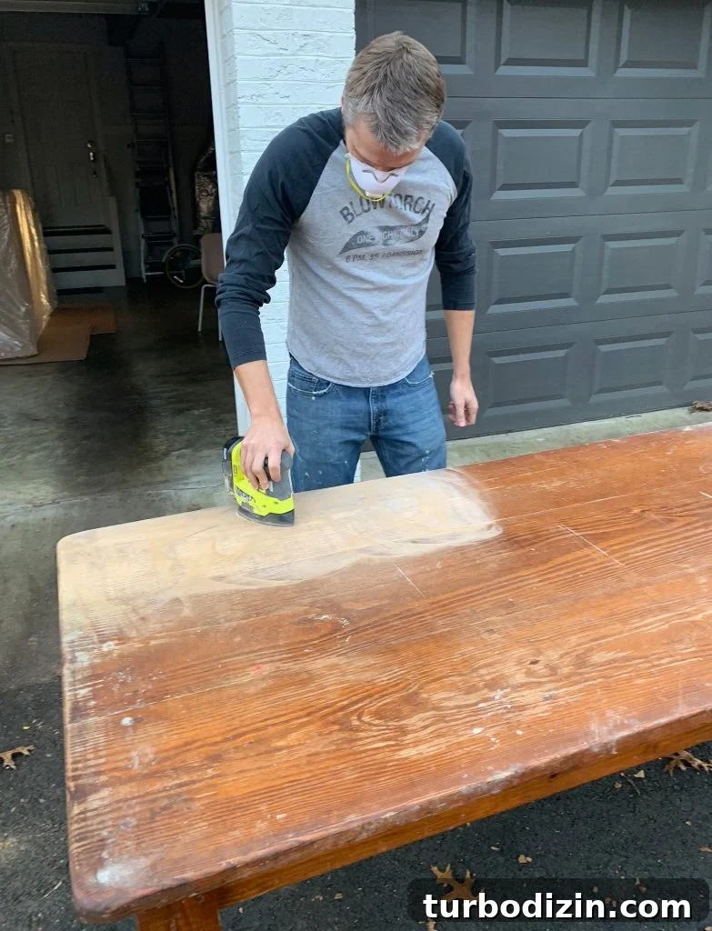 Refinish a Wooden Table: Step-by-Step Guide for Smooth Results 7 John Sanding The Finish Off Wood Dining Table