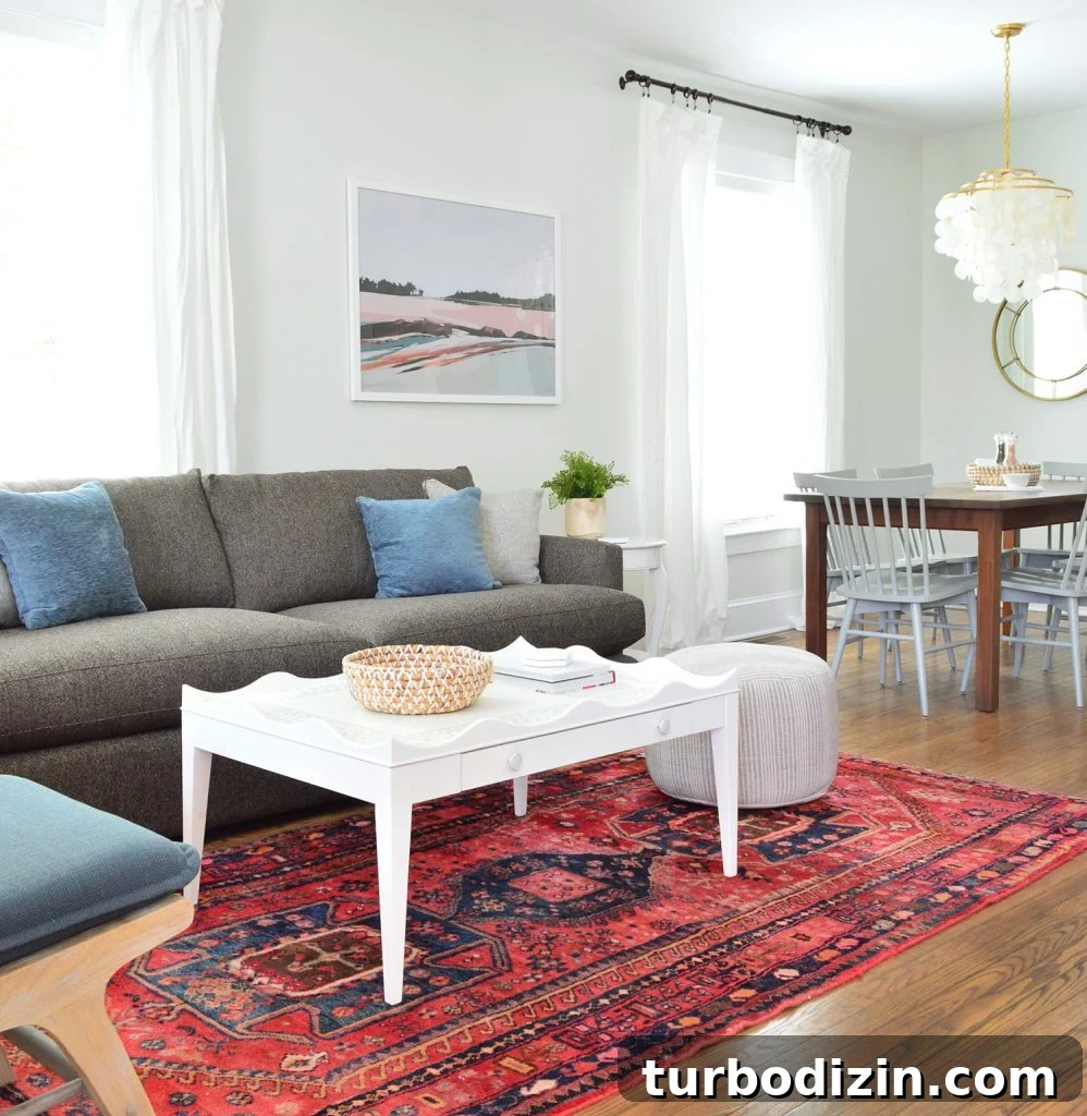 Duplex Living Room and Dining Room Makeovers: Before & After Tour 2 Scallop Coffee Table on Red Rug With Crate And Barrel Sofa