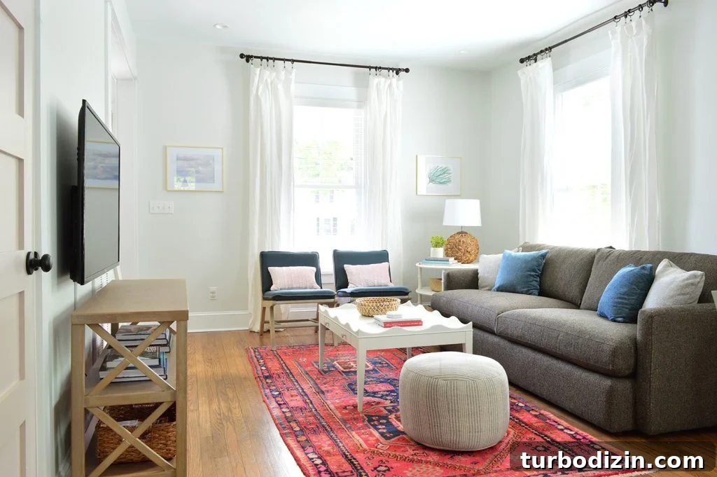 Duplex Living Room and Dining Room Makeovers: Before & After Tour 11 Bright Living Room Red Rug With Blue Target Chairs Crate And Barrel Sofa