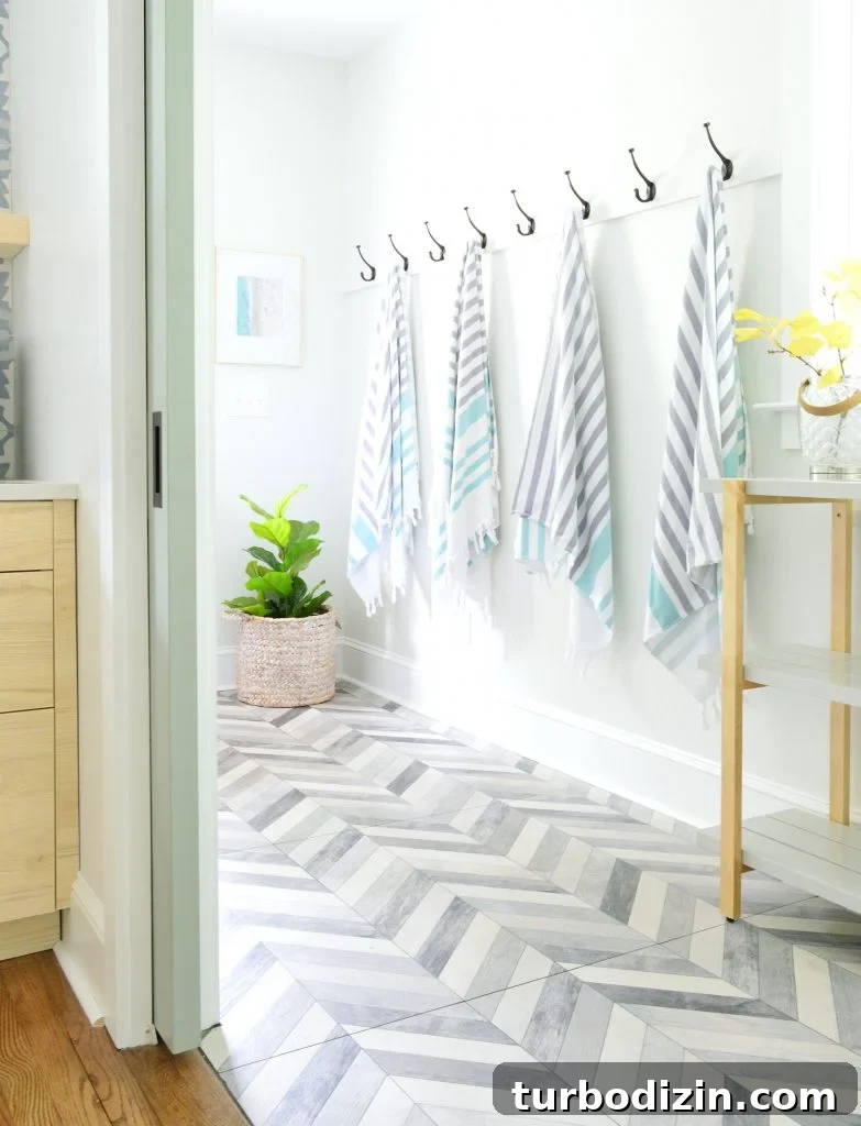 Airbnb Laundry & Mudroom Makeovers: Before and After Transformations 15 Dupex Mudroom Hook Rail With Beach Towels Chevron Tile Floor
