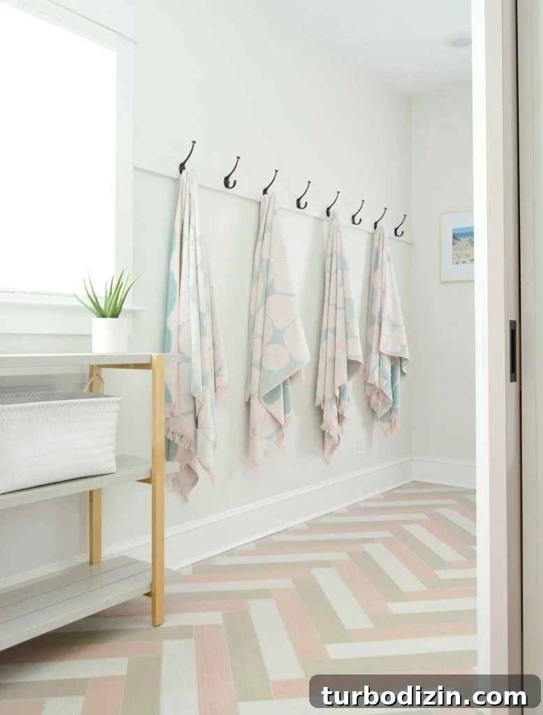 Airbnb Laundry & Mudroom Makeovers: Before and After Transformations 8 Hanging Towel Hook Storage In Duplex Mudroom With Herringbone Tile Floors