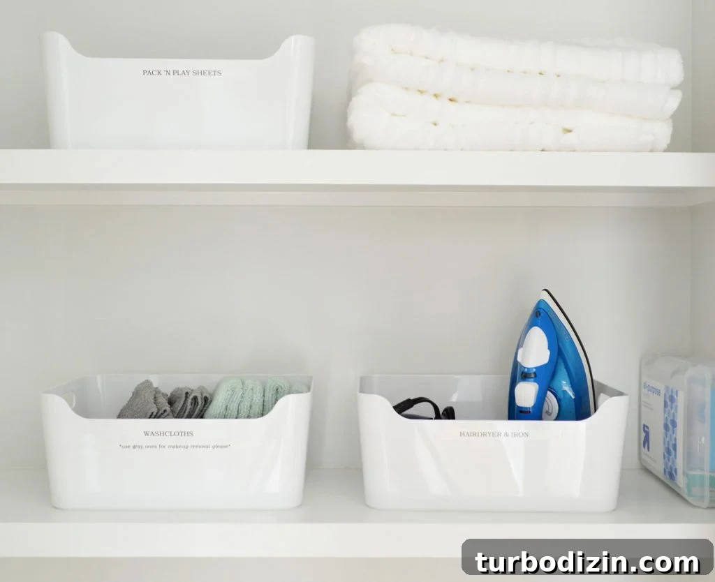 Family-Friendly Airbnb: Kids’ Bedrooms & Storage Tips 12 Labeled White Bins in Duplex Linen Closet