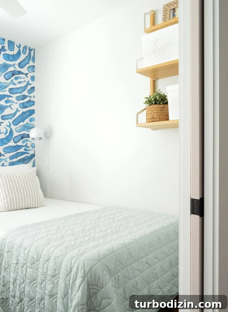 Family-Friendly Airbnb: Kids’ Bedrooms & Storage Tips 7 This image has an empty alt attribute; its file name is Duplex-Bedroom-Blue-Whales-Door-Shelf-751x1024.jpg
