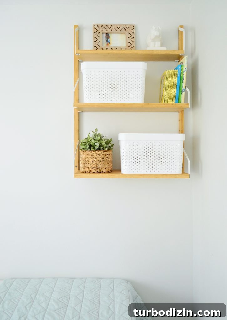 Family-Friendly Airbnb: Kids’ Bedrooms & Storage Tips 8 This image has an empty alt attribute; its file name is Duplex-Bedroom-Blue-Whales-Shelf-Detail-725x1024.jpg