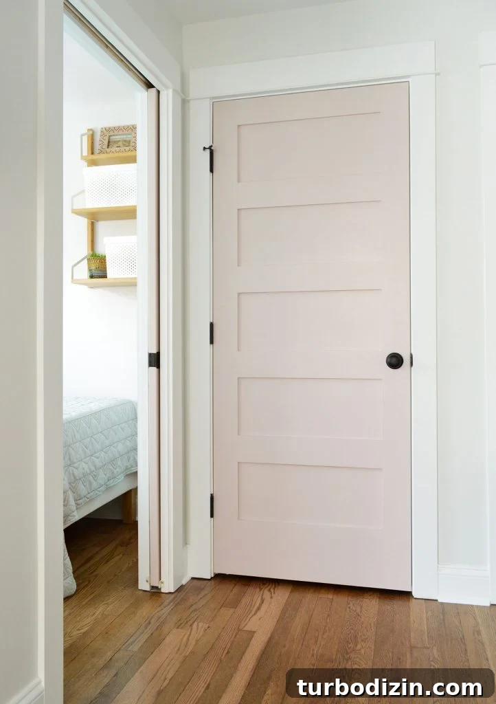 Family-Friendly Airbnb: Kids’ Bedrooms & Storage Tips 9 Duplex Hallway Linen Closet With SW White Truffle Door Closed