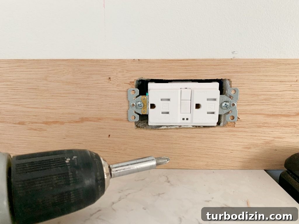 DIY Shiplap Wall Plank Makeover for $31 Total 13 Electrical Outlet Screwed Back In Place Over Panel Strip